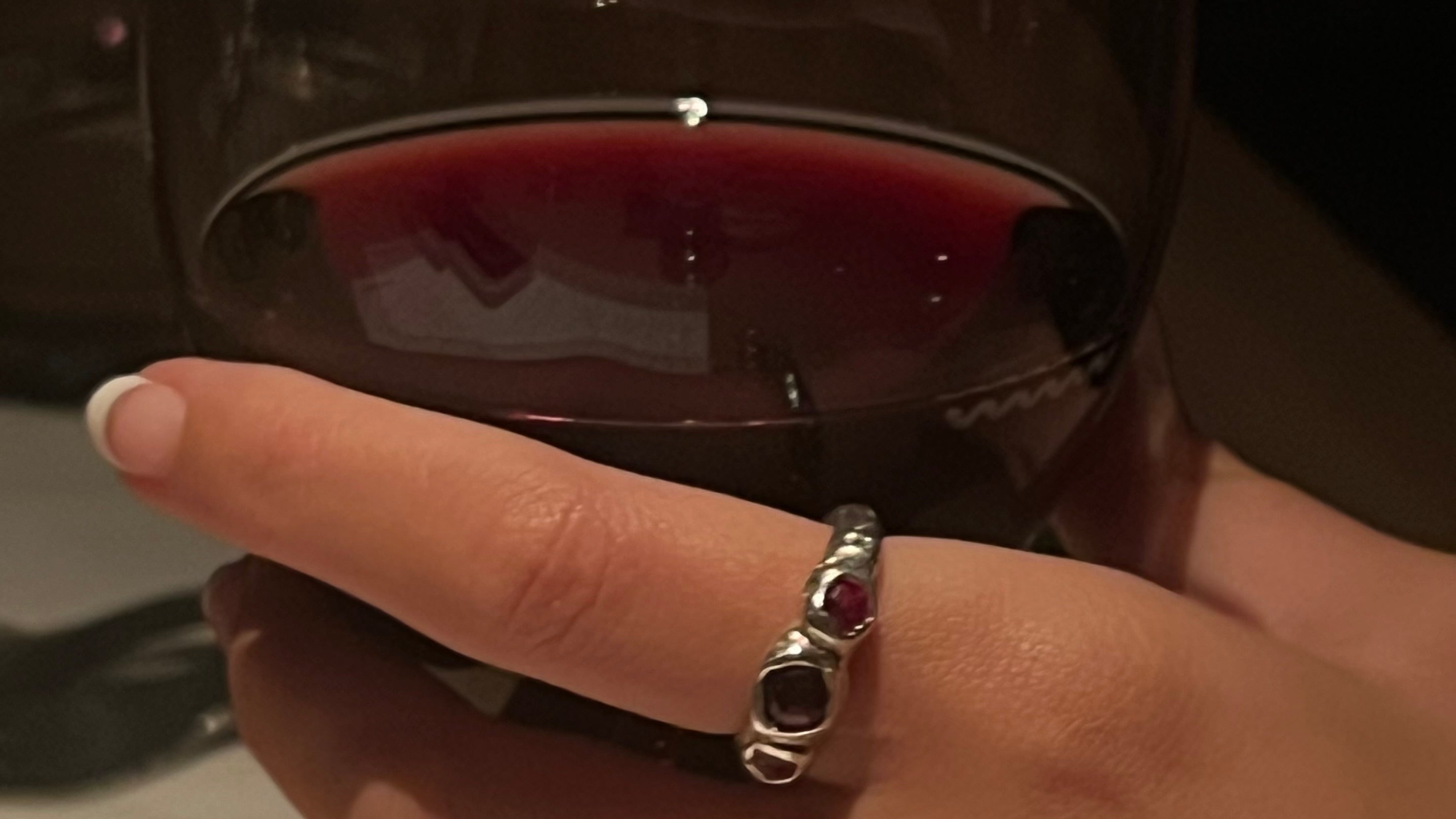 Daisy Collective Ring and Womens hand with wine