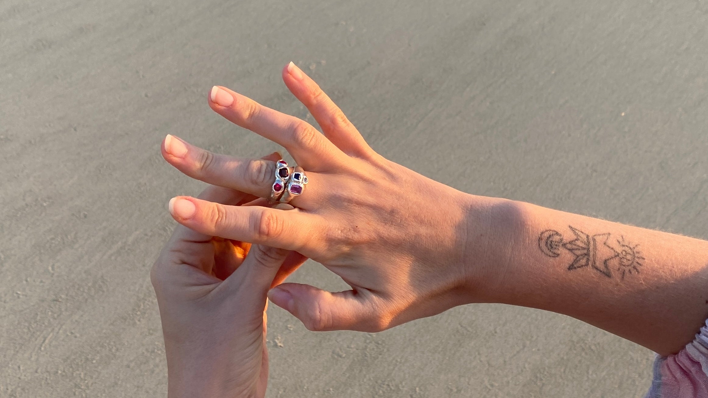 Daisy Collectives Ring on woman's hand at the beach